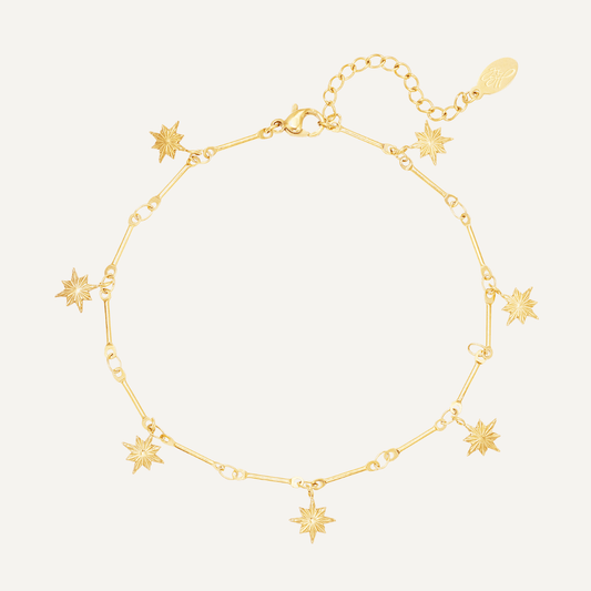 Cavigliera Ronda impreziosita da pendenti a forma di stella, Realizzata in acciaio inossidabile, Finitura oro - Trinwel.com